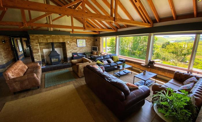The Lodge has a very spacious lounge to relax in, with views across Hafren Forest and Llyn Clywedog.